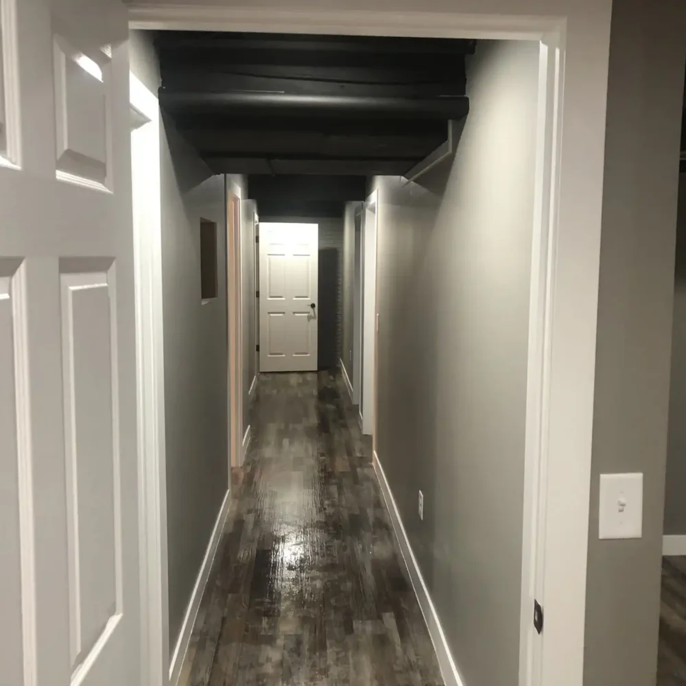 Remodeled Basement Corridor with Modern Flooring